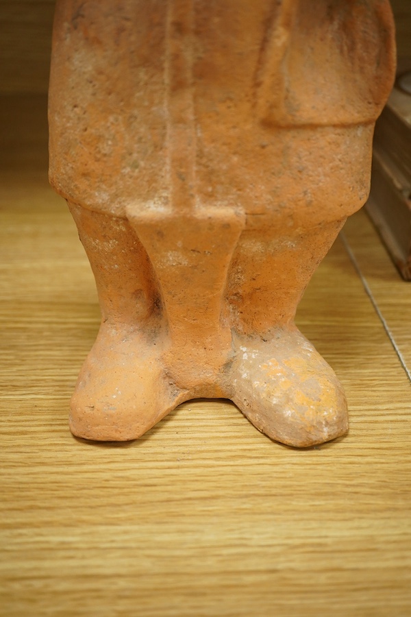 A Han Dynasty-style Chinese terracotta figure, 44cm high. Condition - fair